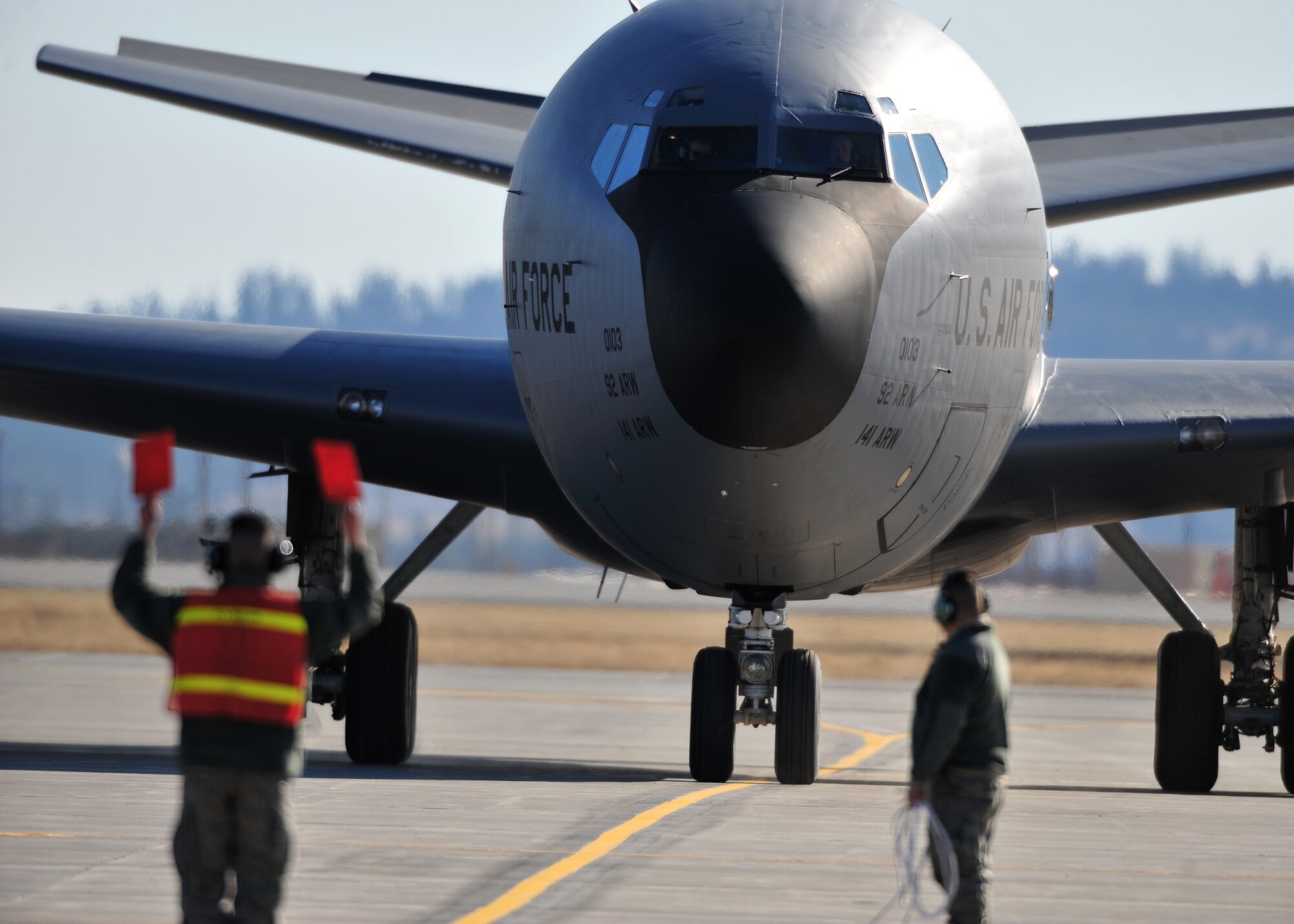 Members of the 92nd Maintenance Group marshall in the first KC-135 to land here in almost a year. Fairchild’s tankers have been operating out of Moses Lake, Wash. and the Spokane International Airport during reconstruction of the base’s runway. (U.S. Air Force photo/Staff Sgt. Michael Means)