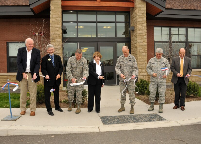 Mr. Gary Sankes of Scrufari Construction, 914th Services Director Mr. Robert Williams, 107 Airlift Wing Vice-Commander Col. John Higgins, Congresswoman Louise Slaughter, 914th Airlift Wing Vice-Commander Col. Bret Larson, Air Force Reserve Command Civil Engineer Col. Nicholas Desport, and Mr. Ray Cudney of Beardsley Design cut the ribbon to the Heritage Center at Niagara November 9, 2011 Niagara Falls Air Reserve Station, NY. The Heritage Center at Niagara is the newest facility to open at the Niagara Falls base. (U.S. Air Force photo by Staff Sgt. Joseph McKee)