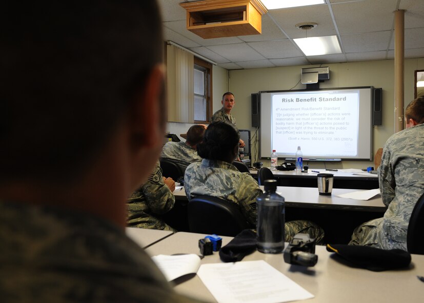 Tech. Sgt. Ryan Tanner, 7th Security Forces Squadron, talks about the risks involved with using a taser during training Nov. 9, 2011 at Dyess Air Force Base, Texas.  Training is conducted annually to ensure 7 SFS airmen are qualified to use a taser. (U.S. Air Force photo by Airman 1st Class Jonathan Stefanko/ Released)