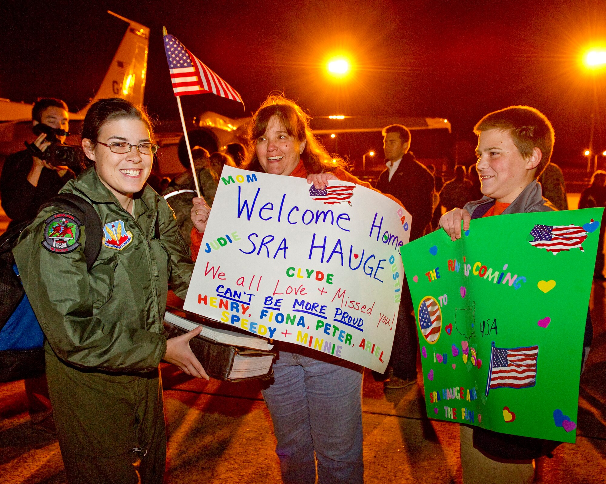 Senior Airman Allison Hauge, 461st Air Control Wing, is excited to see her mother Melinda Hauge and brother Dustin, as she returns from a deployment. Hauge is a flight crew member on the E-8 Joint 
STARS aircraft. U. S. Air Force photo by Master Sgt. Roger Parsons