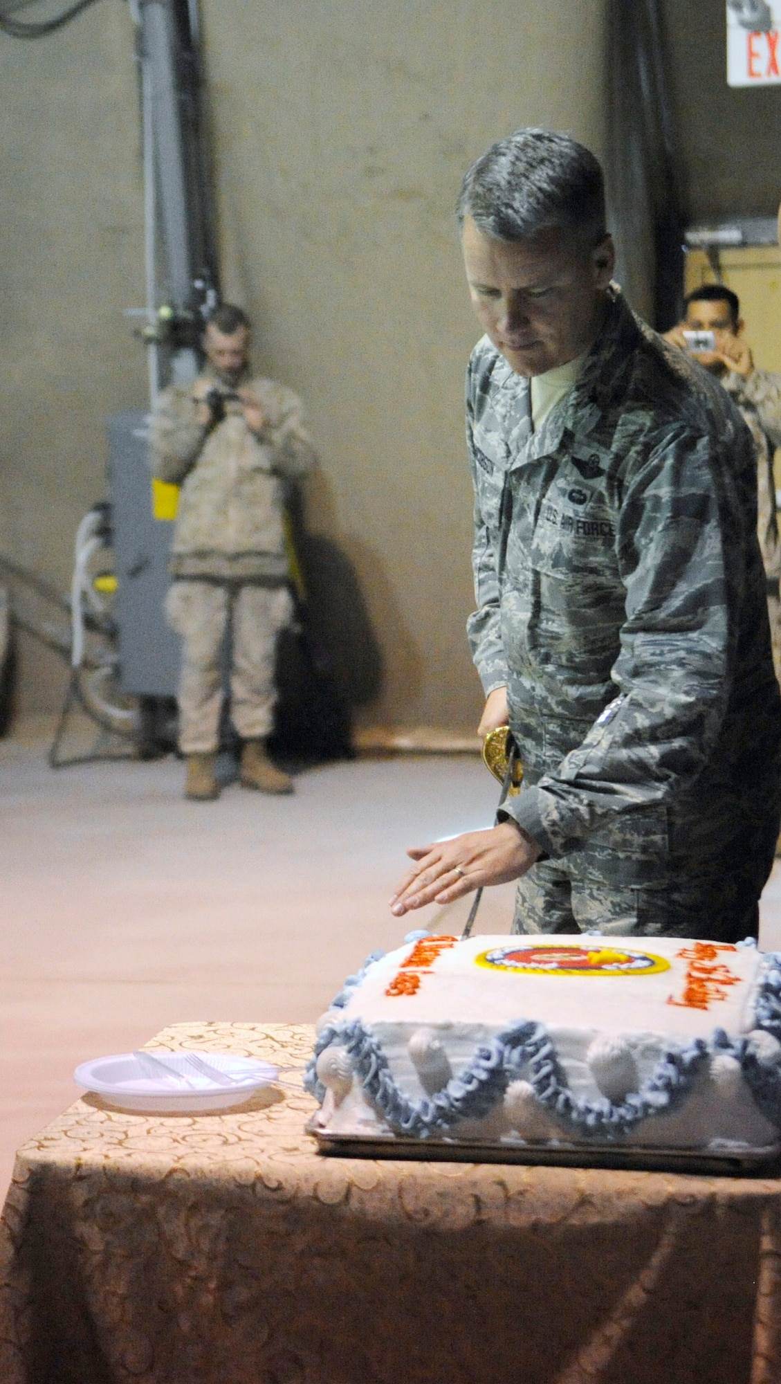 Col. James Jacobson cuts the Marine Corps’ birthday cake during a ceremony celebrating the Corps’ 236th birthday at the Transit Center at Manas, Kyrgyzstan, Nov. 10. Jacobson was the guest of honor at the Marine’s birthday celebration. He was selected as the guest of honor for the support he has provided to the Marines while serving as the 376th Air Expeditionary Wing commander. (U.S. Air Force photo/Tech. Sgt. Tammie Moore)