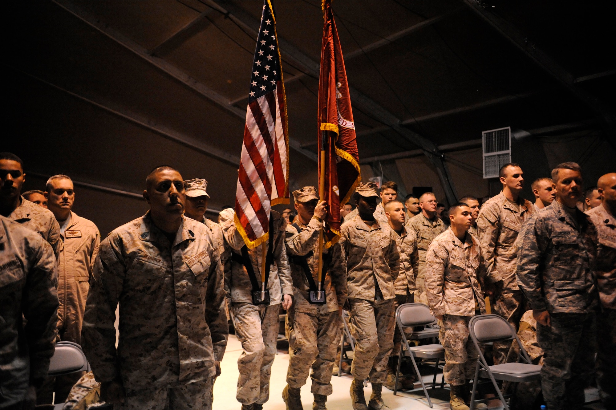 A Marine Corps Color Guard presents the colors during a ceremony celebrating the Corps’ 236th birthday at the Transit Center at Manas, Kyrgyzstan, Nov. 10. Each year during the Marine Corps’ birthday celebration Maj. Gen. John Lejeune’s Marine Corps Order No. 47, Series 1921 is read. The order summarized the history, mission and tradition of the Corps. It also directed that it should be read to every command each Nov. 10 in honor of the birthday of the Marine Corps. (U.S. Air Force photo/Tech. Sgt. Tammie Moore)