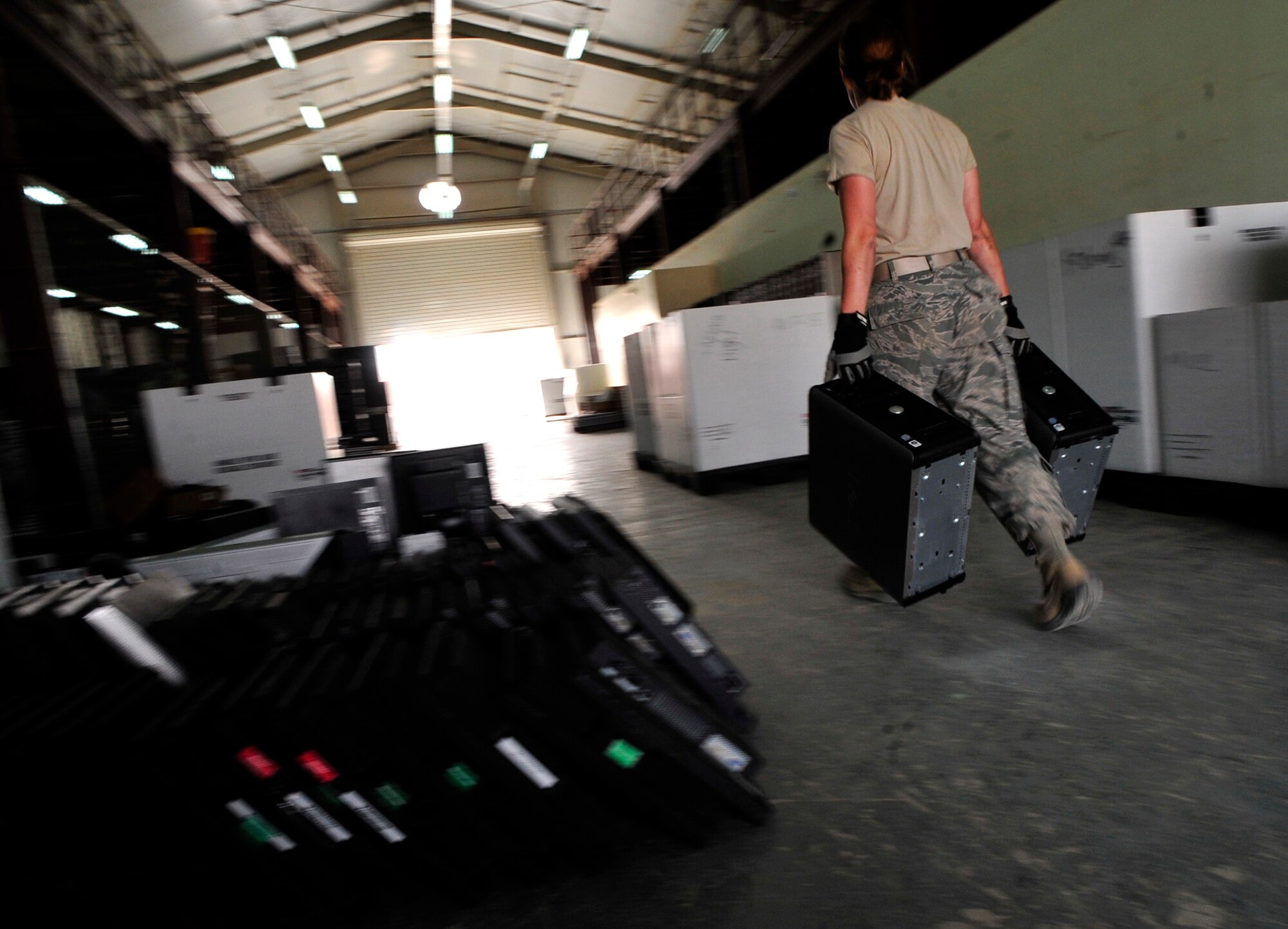 An Airman of the 332nd Air Expeditionary Wing puts away turned-in computer hardware at Joint Base Balad, Iraq, Oct. 15, 2011. More than 12,000 pieces of equipment were turned in during the final days of operation at JB Balad.  JB Balad has disassembled units, turned in equipment, and shut down services to transition the base to the Iraqi government. (U.S. Air Force photo/Master Sgt. Cecilio Ricardo)