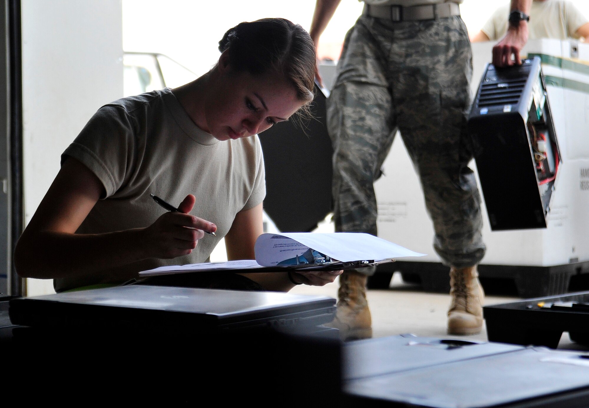 Airman 1st Class Heather O'Donnell, 332nd Air Expeditionary Wing base equipment control officer, takes inventory of all turned-in computer hardware at Joint Base Balad, Iraq, Oct. 15, 2011. JB Balad has disassembled units, turned in equipment, and shut down services to transition the base to the Iraqi government. O'Donnell is deployed from Royal Air Force Lakenheath, England, and is from Eugene, Ore. (U.S. Air Force photo/Master Sgt. Cecilio Ricardo)