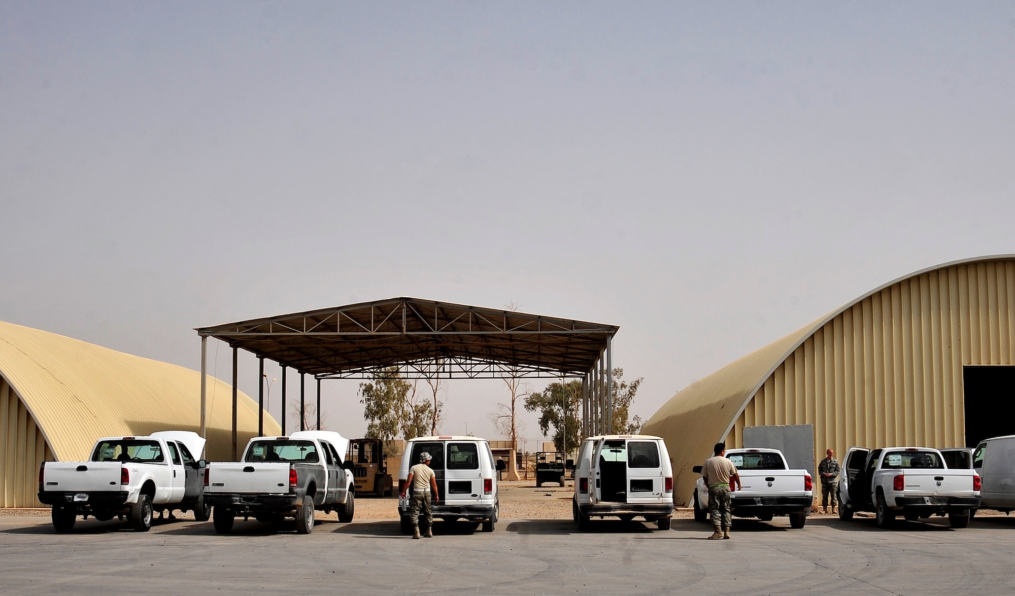 Vehicle maintainers inspect turned-in vehicles at Joint Base Balad, Iraq, Oct. 15, 2011. More than 1,000 vehicles were inspected and redistributed as part of JB Balad’s closure. JB Balad has disassembled units, turned in equipment, and shut down services to transition the base to the Iraqi government. (U.S. Air Force photo/Master Sgt. Cecilio Ricardo)