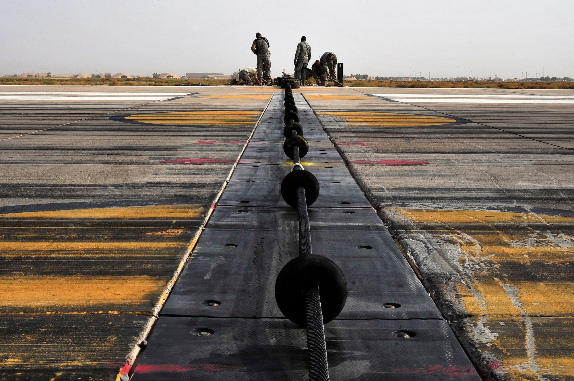 Electric power production Airmen from the 332nd Expeditionary Civil Engineer Squadron, disassemble a mobile aircraft arresting system on the flightline of Joint Base Balad, Iraq, Oct. 15, 2011.  JB Balad has disassembled units, turned in equipment, and shut down services to transition the base to the Iraqi government. (U.S. Air Force photo/Master Sgt. Cecilio Ricardo)