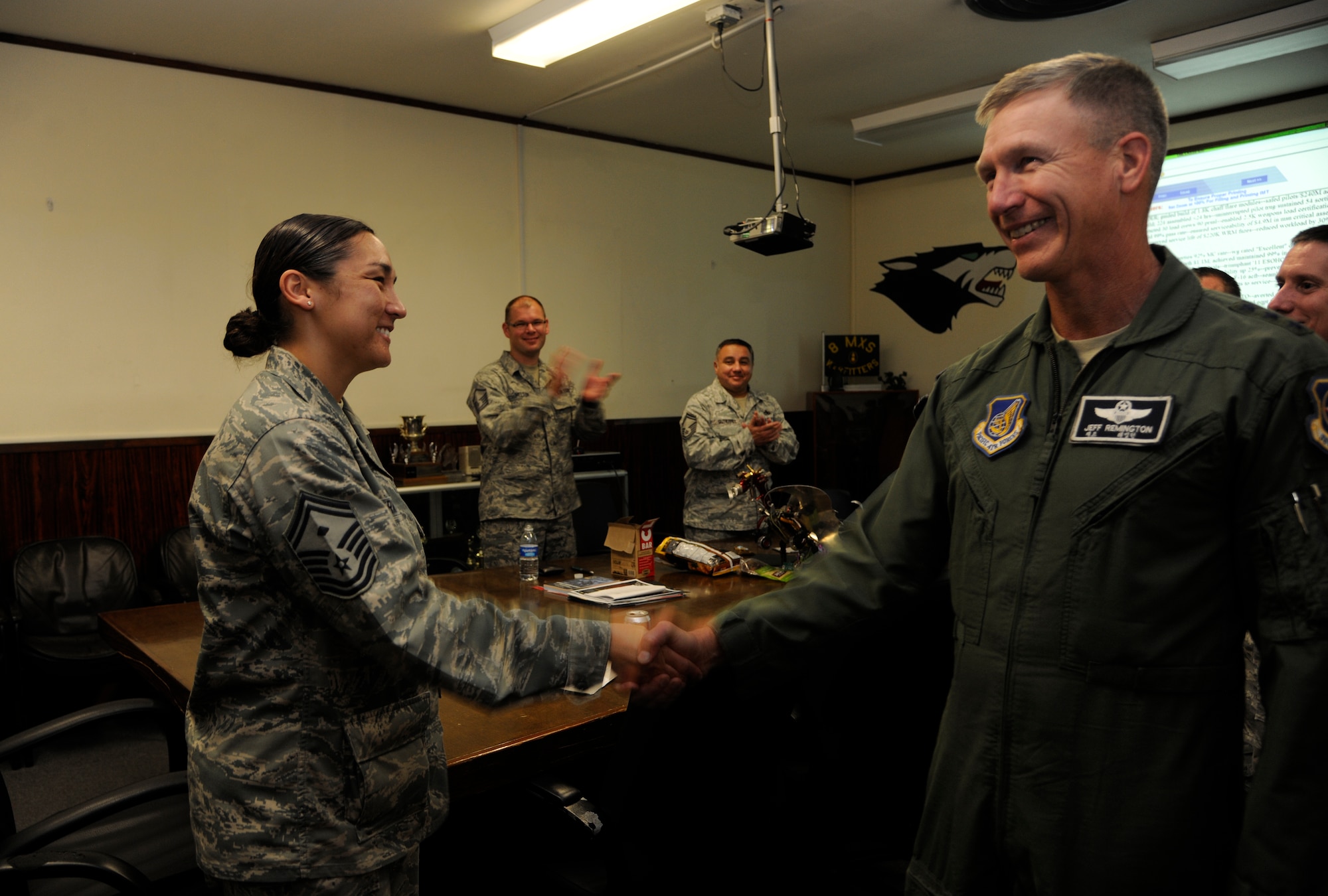 Lt. Gen. Jeffrey A. Remington, Seventh Air Force, Air Forces Korea commander, congratulates Senior Master Sgt. Kimberly Armijo, 8th Maintenance Squadron first sergeant, on her selection for promotion to chief master sergeant at Kunsan Air Base, Republic of Korea, on Nov. 3, 2011. (U.S. Air Force photo by Staff Sgt. Rasheen Douglas/Released)