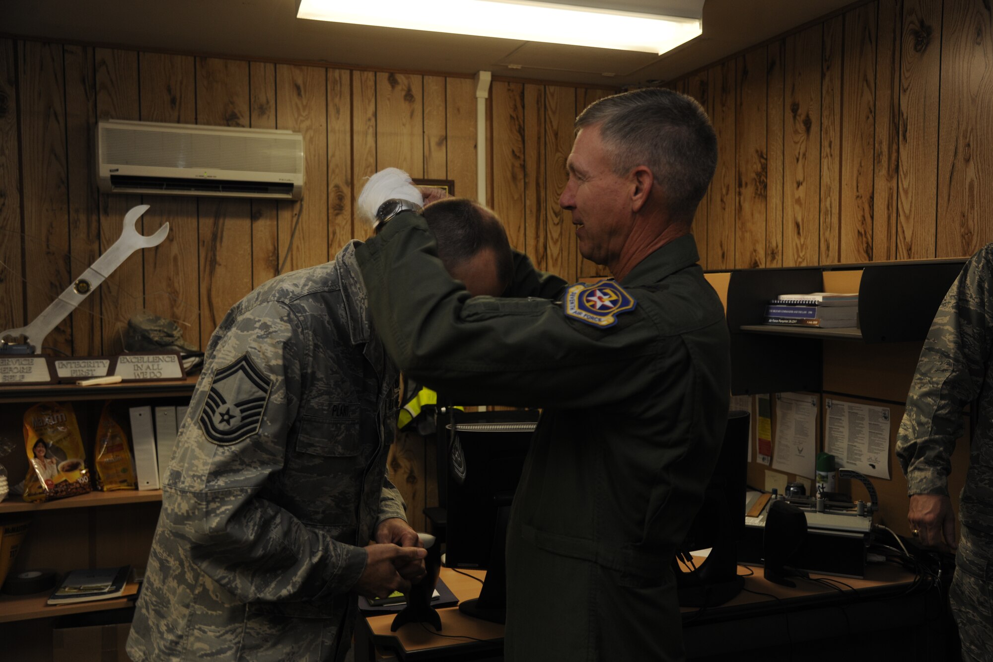 Lt. Gen. Jeffrey A. Remington, Seventh Air Force, Air Forces Korea commander, congratulates Senior Master Sgt. Bradley Plante, 8th Maintenance Squadron, on his selection for promotion to chief master sergeant at Kunsan Air Base, Republic of Korea, on Nov. 3, 2011. (U.S. Air Force photo by Staff Sgt. Rasheen Douglas/Released)