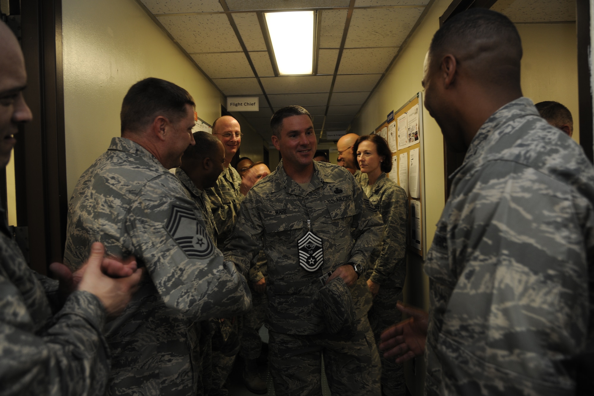 Senior Master Sgt. Shane Ware, 8th Communications Squadron, shakes hands with 8th Fighter Wing leadership congratulating him on his selection for promotion to chief master sergeant at Kunsan Air Base, Republic of Korea, on Nov. 3, 2011. (U.S. Air Force photo by Staff Sgt. Rasheen Douglas/Released)