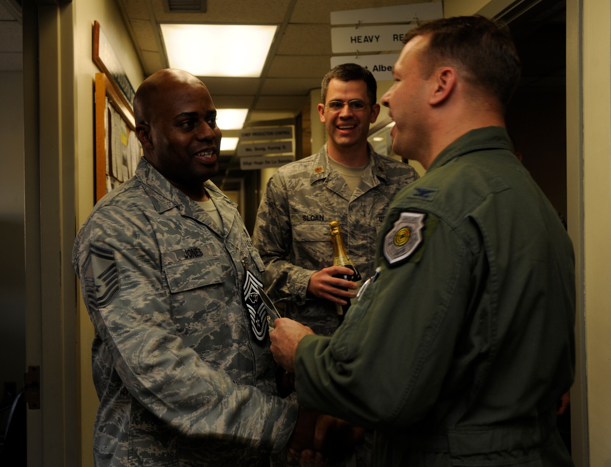 Col. Stephen Williams, 8th Fighter Wing vice commander, congratulates Senior Master Sgt. Patrick Jones, 8th Civil Engineer  Squadron, on his selection for promotion to chief master sergeant at Kunsan Air Base, Republic of Korea, on Nov. 3, 2011. (U.S. Air Force photo by Staff Sgt. Rasheen Douglas/Released)