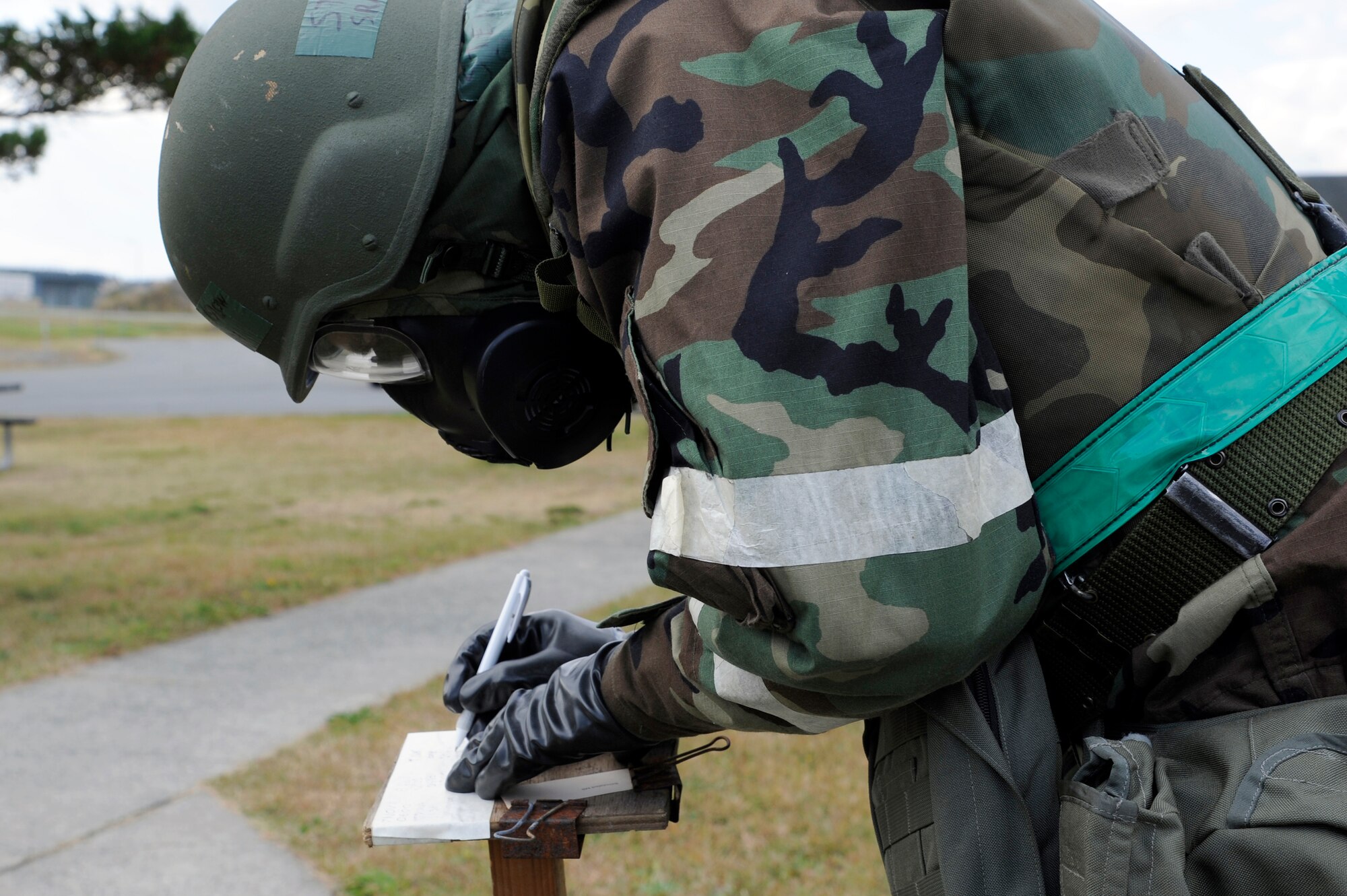 MISAWA AIR BASE, Japan - Senior Airman Steven Winslow, 35th Maintenance Squadron, inspects simulated M8 paper while performing a post attack reconnaissance sweep during an operational readiness exercise here Nov. 9. The 35th Fighter Wing is going through rehearsed procedures during a base ORE, to train for the operational readiness inspection next month. (U.S. Air Force photo/Tech. Sgt. Marie Brown)