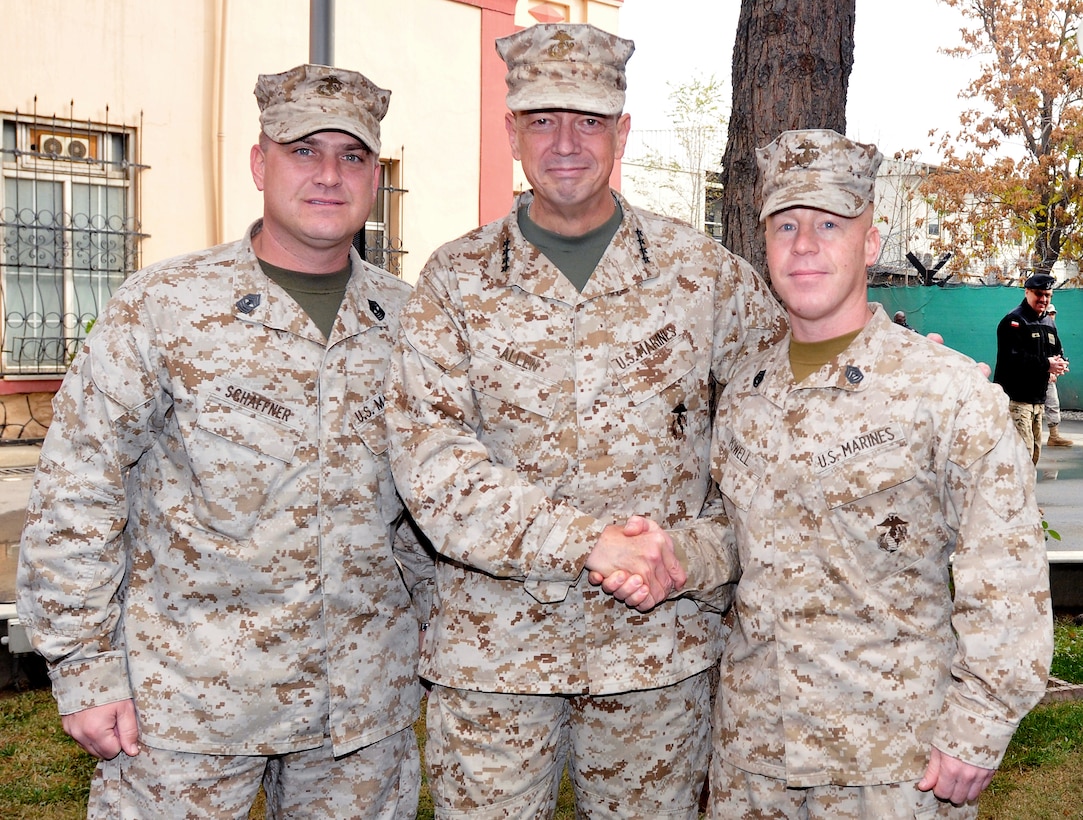 U.S. Marine Corps Gen. John R. Allen, commander of the International Security Assistance Force in Afghanistan, shakes hands with fellow Marines and poses for a photo after the Marine Corps birthday cake cutting ceremony at ISAF Headquarters in Kabul, Afghanistan, Nov. 10, 2011. Before wishing his fellow Marines a happy 236th birthday, Allen presided over the cake cutting and then presented slices to the oldest and youngest Marines present. After the ceremony, the ISAF Commander visited with fellow Marines.