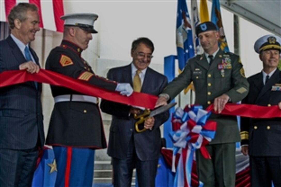 Defense Secretary Leon E. Panetta cut the ceremonial ribbon during the dedication of the new Walter Reed National Military Medical Center in Bethesda, Md., Nov. 10, 2011. Secretary Panetta stated that he had cut ribbons to many buildings over his career but never for one that will save lives.