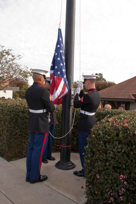 (Left to right) Cpl. John Robbart III, Sgt. Thomas G. Ochoa, Lance Cpl. John H. Fulton, all Marines with the 15th Marine Expeditionary Unit raise the American flag in honor of Veteran’s day at Aviara Oaks Elementary School, Nov. 10. The Marines are also part of the unit’s color guard. (U.S. Marine Corps photo by Gunnery Sgt. Jennifer M. Antoine)