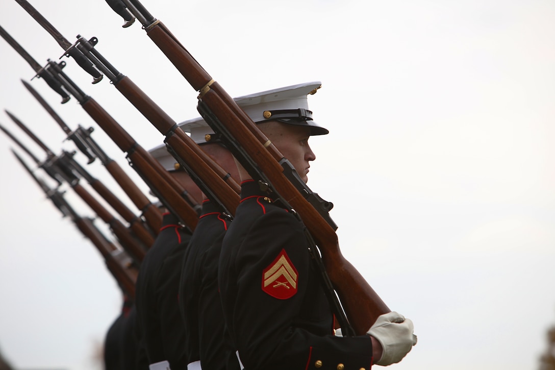 Marines with Marine Barracks Washington march during pass in review as part a wreath-laying ceremony to commemorate the 236th birthday of the Marine Corps at the Marine Corps War Memorial in Arlington, Va., Nov. 10. After the ceremony, six teams from the Barracks visited various graves of former commandants and sergeants major of the Marine Corps in the National Capital Region to honor those former leaders of the Corps.