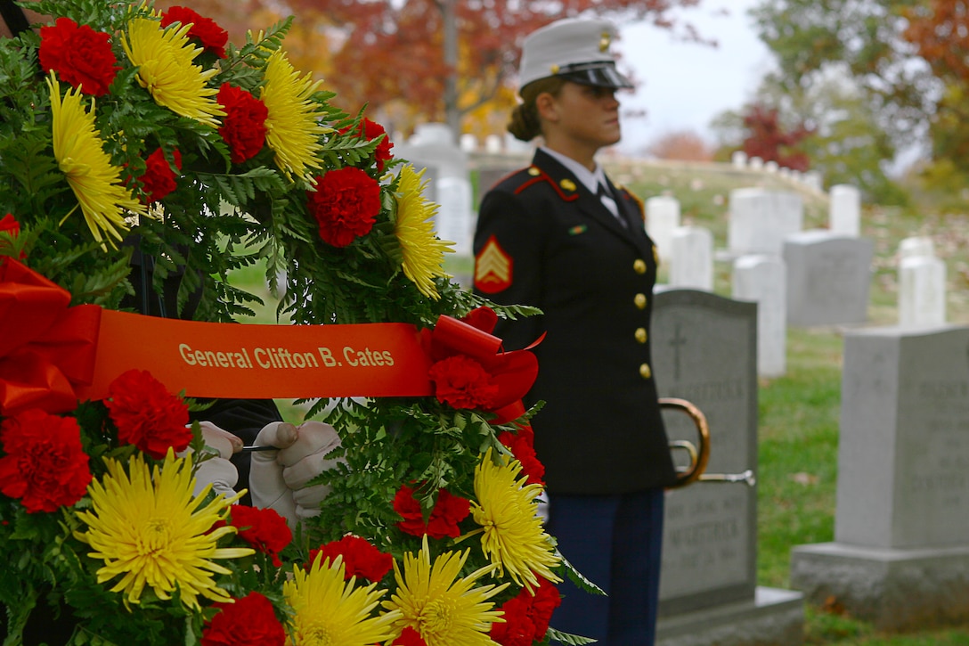 Sgt. Codie Williams, a ceremonial bugler with the U.S. Marine Drum and Bugle Corps, prepares to play taps prior to a wreath-laying ceremony at the gravesite of Gen. Clifton B. Gates, 19th Commandant of the Marine Corps, in Arlington National Cemetery Nov. 10. Six teams from the Barracks visited various graves of former commandants and sergeants major of the Marine Corps in the National Capital Region to honor those former leaders of the Corps on the 236th Marine Corps birthday.