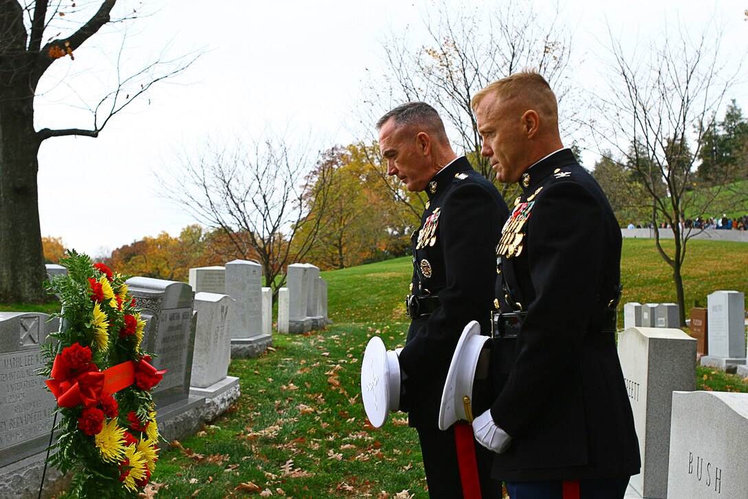 Gen. Joseph F. Dunford, assistant commandant of the Marine Corps, and Col. Paul D. Montanus, Marine Barracks Washington commanding officer, pause for a moment of silence during a wreath-laying ceremony at the gravesite of Gen. Clifton B. Gates, 19th commandant of the Marine Corps, in Arlington National Cemetery Nov. 10. Six teams from the Barracks visited various graves of former commandants and sergeants major of the Marine Corps in the National Capital Region to honor those former leaders of the Corps on the 236th Marine Corps birthday.