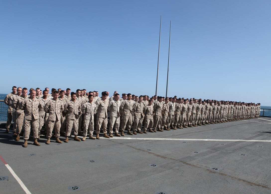 Marines with Echo Company, Battalion Landing Team (BLT), 2nd Battalion, 2nd Marine Regiment, 22nd Marine Expeditionary Unit (MEU), stand in formation during a Marine Corps Birthday Ceremony aboard amphibious dock landing ship USS Whidbey Island (LSD 41), Nov. 10, 2011. The 22nd MEU is currently deployed as part of the Bataan Amphibious Ready Group (BATARG) supporting maritime security operations and theater security cooperation efforts in the U.S. 5th Fleet area of responsibility.