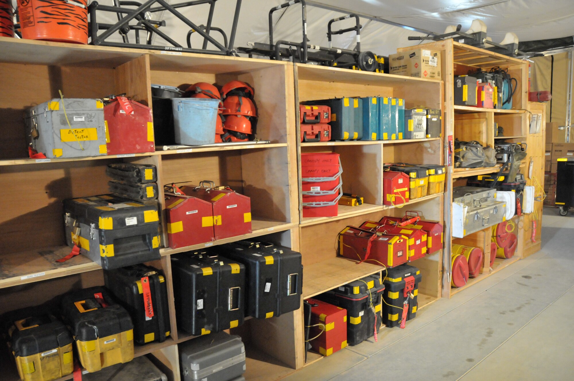 What appears to be custom constructed shelves are actually old dormitory storage closets being used to store and organize maintenance equipment for Airmen assigned to the 332nd Expeditionary Aircraft Maintenance Squadron at an undisclosed location in Southwest Asia Nov. 8, 2011. Airmen from the 332nd EAMXS had to get creative by finding used old lockers, shelves and other furniture found in scrap heaps to help enhance their facilities. (U.S. Air Force photo by Master Sgt. Paul Mann)
