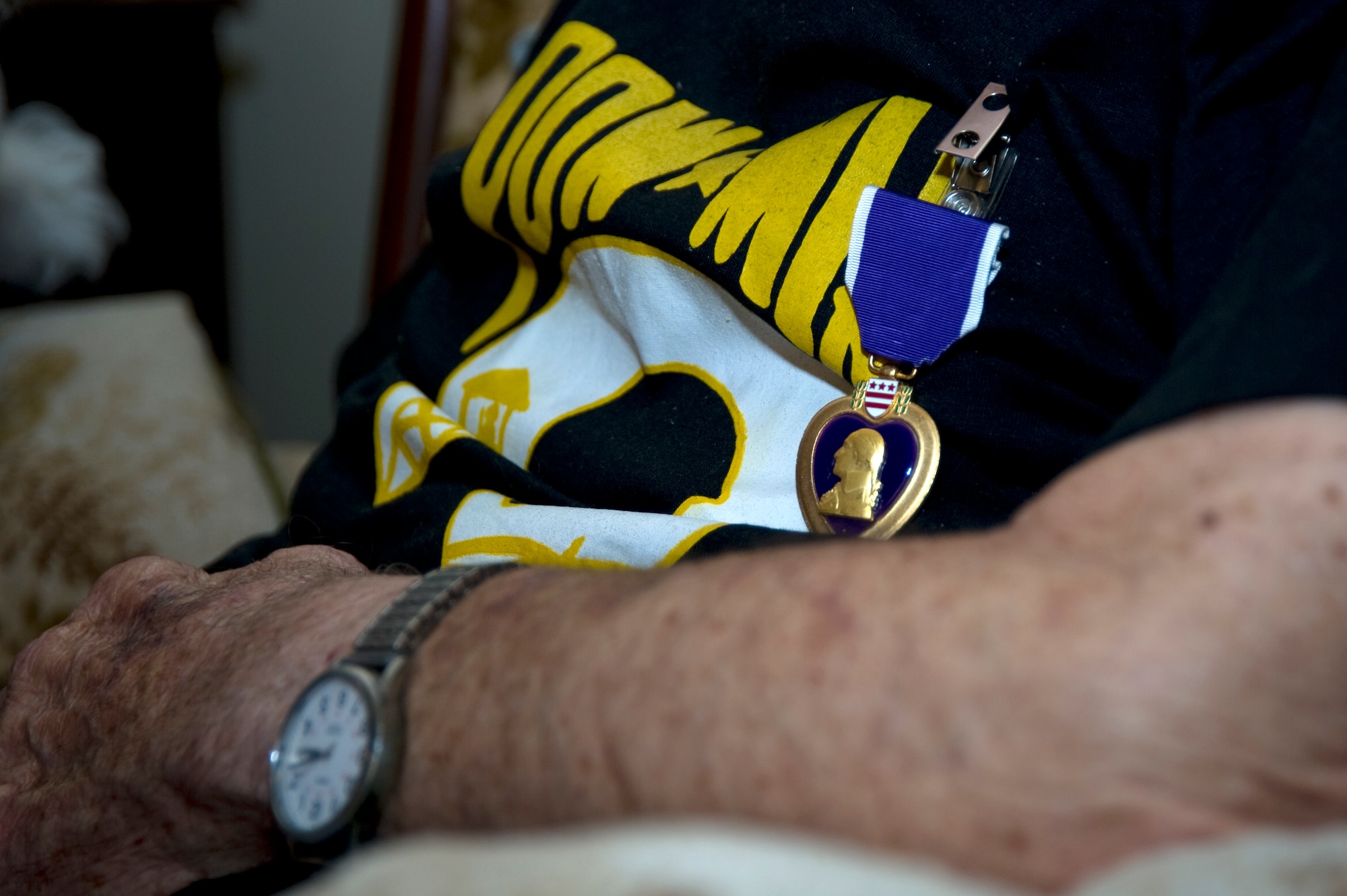 Retired U.S. Air Force Tech. Sgt. Pete Loss received the Purple Heart in a ceremony at his private residence in Fort Walton Beach, Nov. 11, 2011. The medal was presented by Col. Jim Slife, commander of the 1st Special Operations Wing, for the sacrifices Loss made during World War II as a prisoner of war and Bataan Death March survivor. (U.S. photo/Airman 1st Class Naomi Griego)(RELEASED)