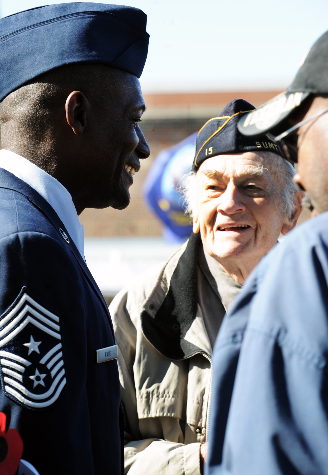 U.S. Air Force Chief Master Sgt. Lefford Fate, 20th Fighter Wing command chief, speaks with veterans after the Veterans Day Ceremony at the Sumter County Courthouse, S.C., Nov. 11, 2011. The Sumter County Veterans Association joined with Team Shaw and the Sumter community to remember and honor those who have given so much in the defense of American freedoms and ideals.(U.S. Air Force photo by Airman 1st Class Tabatha Duarte/Released)
