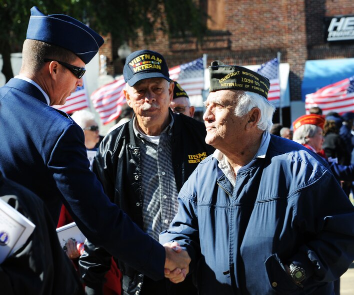 U.S. Air Force Col. Charlie Moore, 20th Fighter Wing commander shakes the hands of veterans after the Veterans Day Ceremony at the Sumter County Courthouse, S.C., Nov. 11, 2011. The Sumter County Veterans Association joined with Team Shaw and the Sumter community to remember those who have given so much in the defense of American freedoms and ideals.(U.S. Air Force photo by Airman 1st Class Tabatha Duarte/Released)