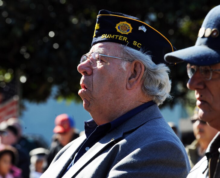 Veterans and locals sing "God Bless America," during the Veterans Day Ceremony at the Sumter County Courthouse, S.C., Nov. 11, 2011. The Sumter County Veterans Association joined with Team Shaw and the Sumter community to remember those who have given so much in the defense of American freedoms and ideals.(U.S. Air Force photo by Airman 1st Class Tabatha Duarte/Released)