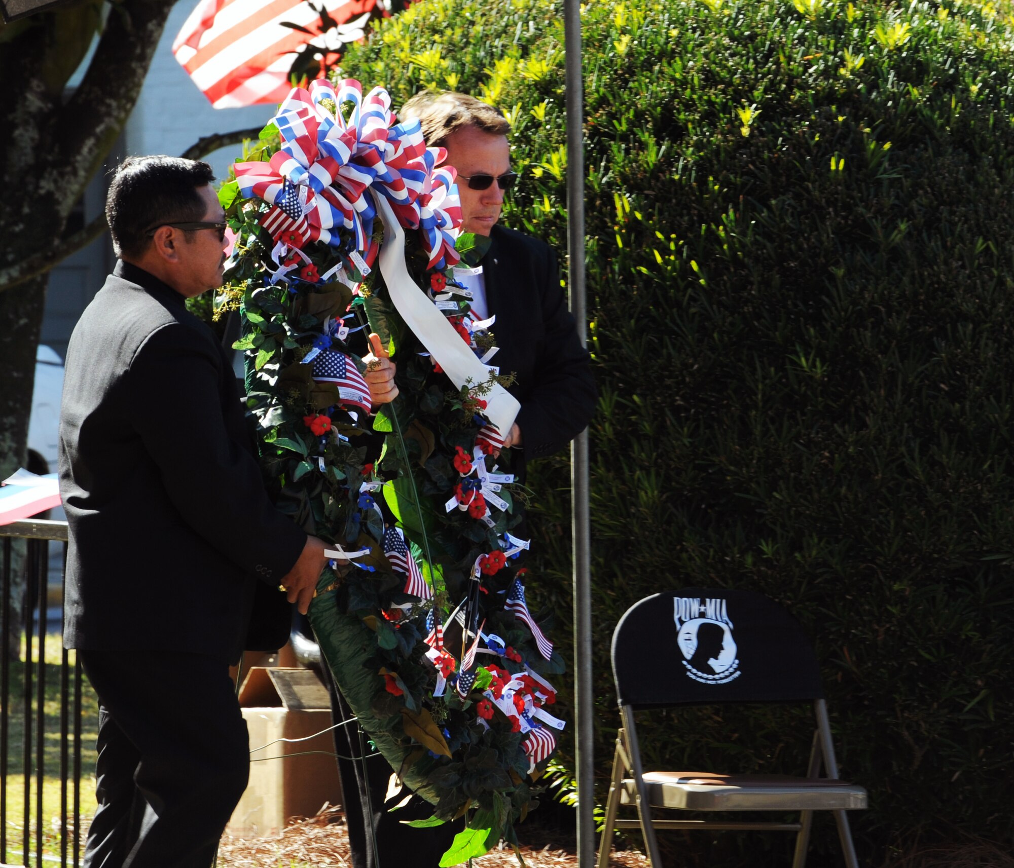 Guy Chapura, of the Knights of Columbus and Steve Ikeda, of the Elks Club, prepare to place the Veterans Day Wreath, during the Veterans Day Ceremony at the Sumter County Courthouse, S.C., Nov. 11, 2011. The Sumter County Veterans Association joined with Team Shaw and the Sumter community to remember those who have given so much in the defense of American freedoms and ideals. Veterans Day is held annually to celebrate patriotism and the love for our country. (U.S. Air Force photo by Airman 1st Class Tabatha Duarte/Released)