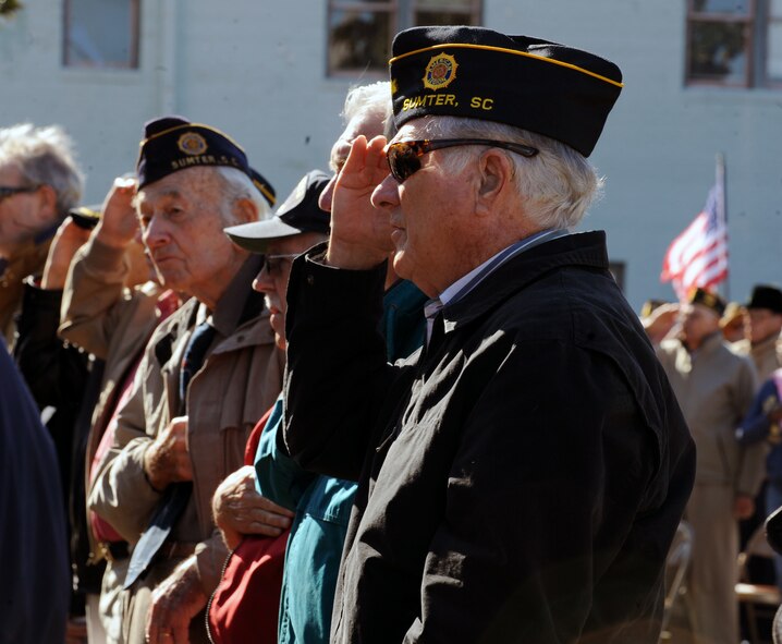 Veterans salute during the National Anthem at the Veterans Day Ceremony, Sumter County Courthouse, S.C., Nov. 11, 2011. The Sumter County Veterans Association joined with Team Shaw and the Sumter community to remember those who have given so much in the defense of American freedoms and ideals. Veterans Day is held annually to celebrate patriotism and the love for our country. (U.S. Air Force photo by Airman 1st Class Tabatha Duarte/Released)