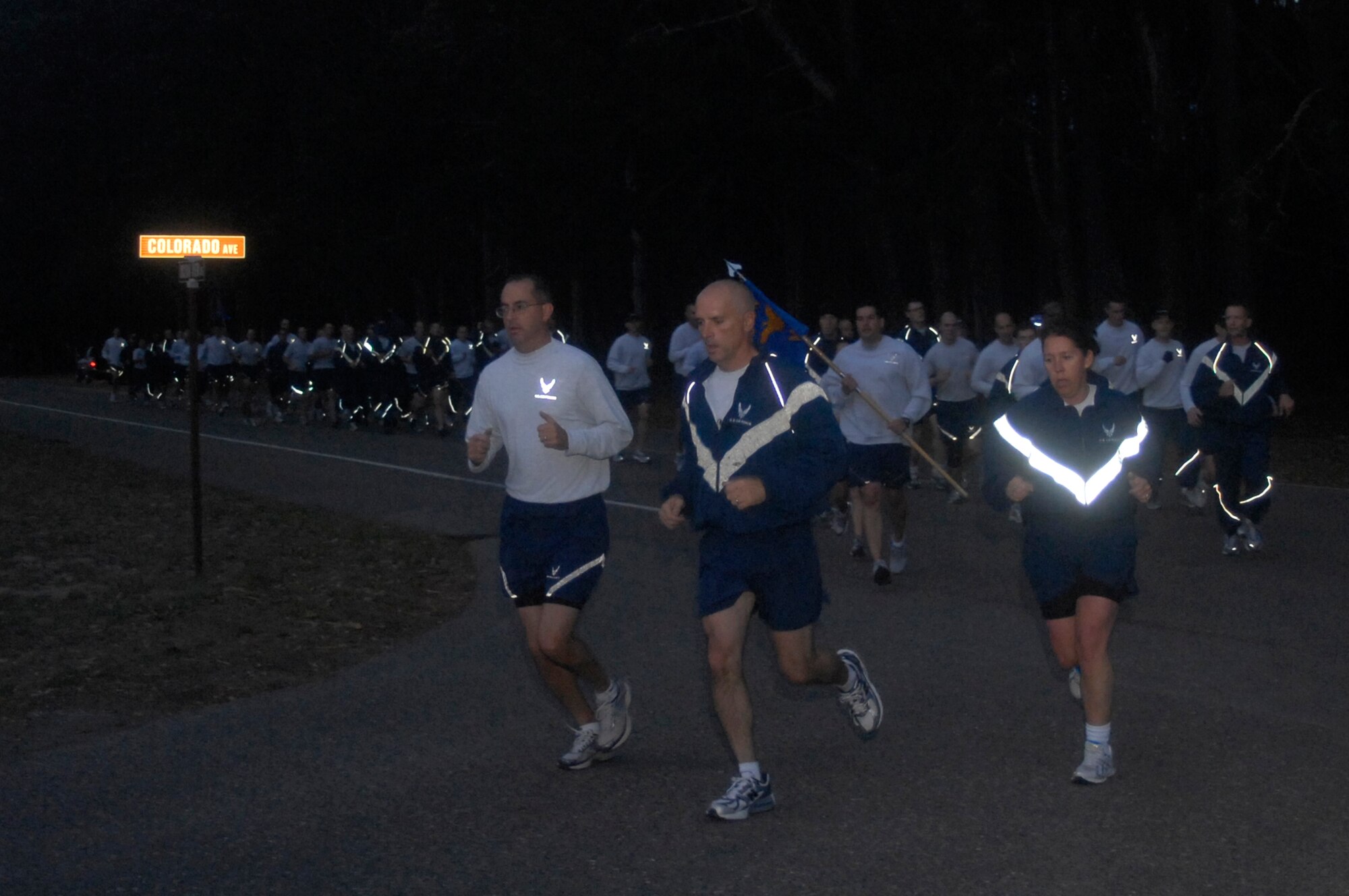 VANDENBERG AIR FORCE BASE, Calif. - Col. Richard Boltz, the 30th Space Wing commander, Col. Keith Balts, the 30th SW vice commander, and Chief Master Sgt. Suzanne Talbert, the 30th SW command chief, lead the way in a formation run during the Run to Remember closing ceremony here Friday, Nov. 11, 2011. A Run to Remember began Oct. 20, and more than 12,000 miles were run by Team V members in honor of the 6,249 military members who lost their lives in support of Operations Iraqi Freedom, Enduring Freedom and New Dawn. (U.S. Air Force photo/Senior Airman Lael Huss)

