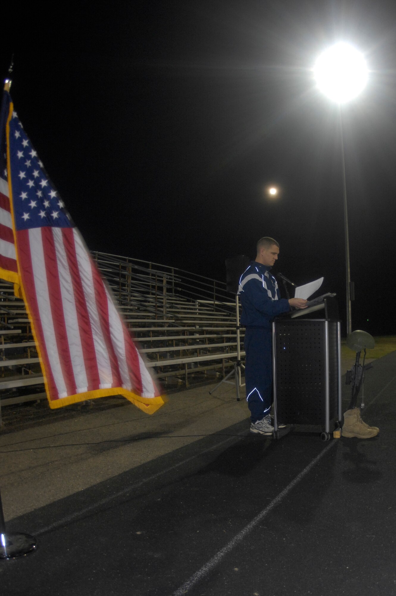 VANDENBERG AIR FORCE BASE, Calif. -- Capt. Andrew Ferguson, a 30th Security Forces Squadron logistics officer, reads the names of fallen military members during the Run to Remember closing ceremony at the base track Friday, Nov. 11, 2011. The 36 names were of those members who lost their lives after Oct. 20, 2011, which was the beginning date of this year’s Run to Remember. The run was held in honor of the 6,249 military members who lost their lives in support of Operations Iraqi Freedom, Enduring Freedom and New Dawn. (U.S. Air Force photo/Senior Airman Lael Huss)


 