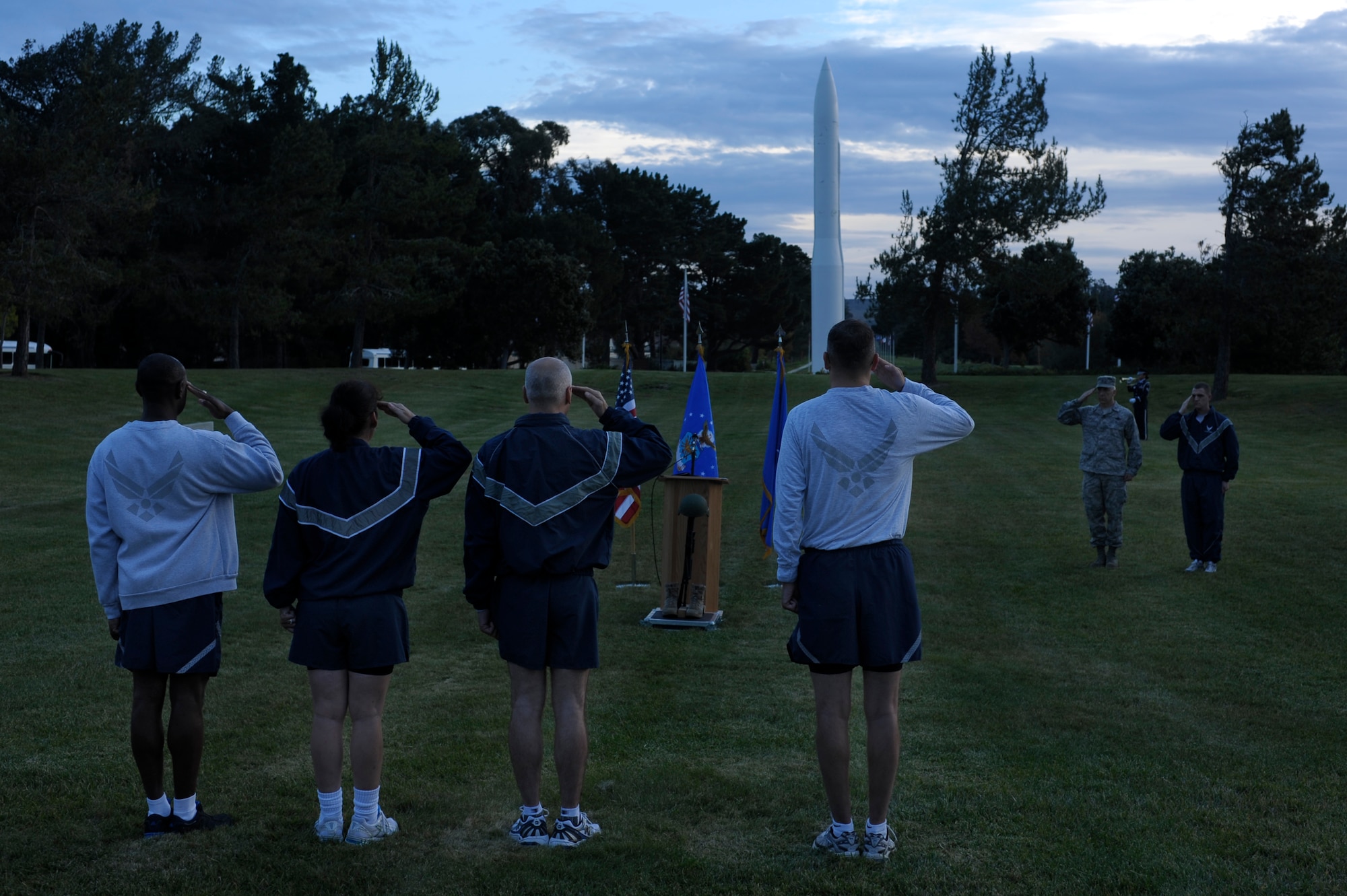 VANDENBERG AIR FORCE BASE, Calif. -- Members of the 14th Air Force and 30th Space Wing leadership salute while Taps is played during the Run to Remember closing ceremony here Friday, Nov. 11, 2011. A Run to Remember began Oct. 20, and more than 12,000 miles were run by Team V members in honor of the 6,249 military members who lost their lives in support of Operations Iraqi Freedom, Enduring Freedom and New Dawn. (U.S. Air Force photo/Staff Sgt. Andrew Satran)