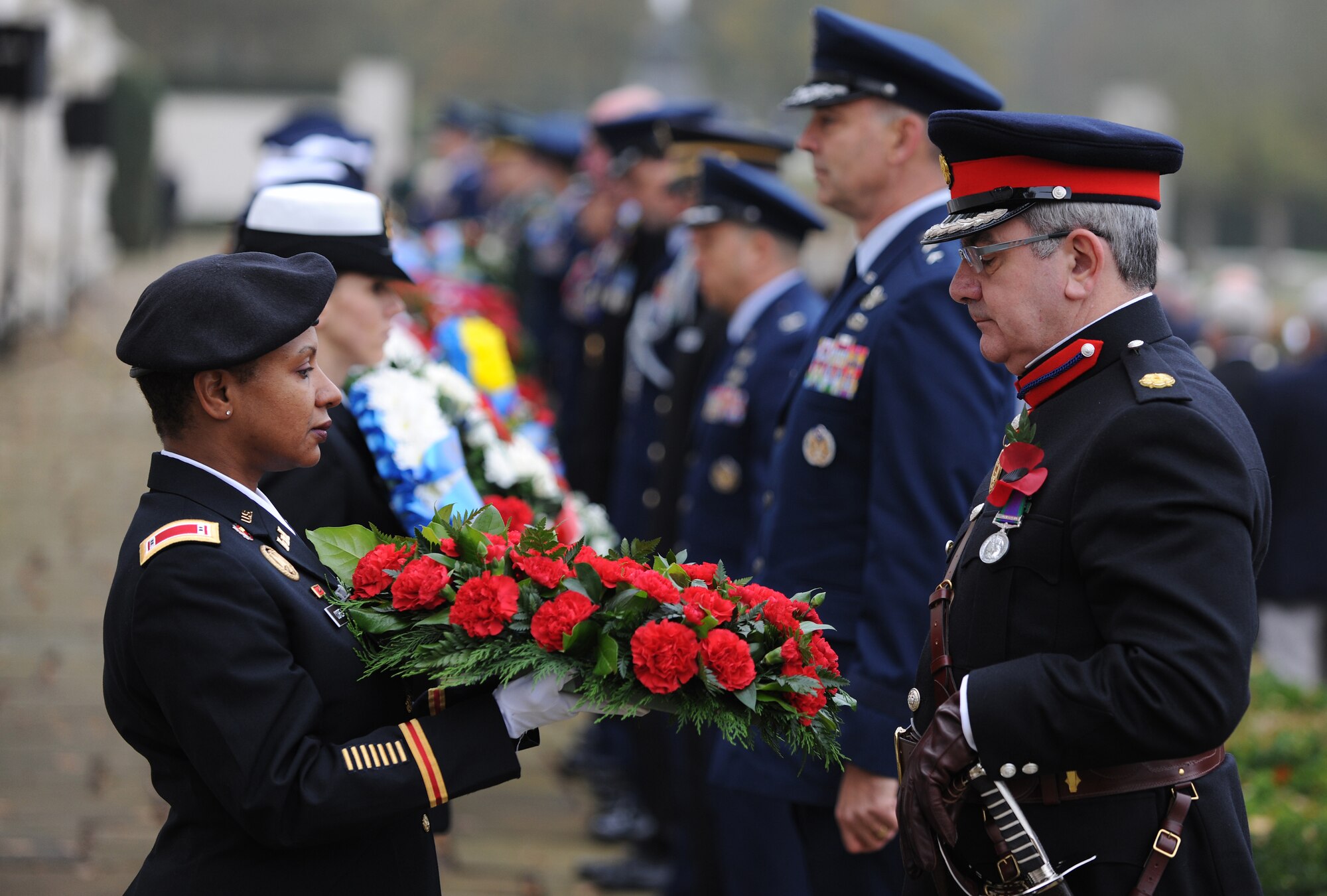 CAMBRIDGE, United Kingdom - American and British servicemembers pay tribute to veterans during a ceremony at Cambridge American Cemetery and Memorial Nov. 11. More than 300 servicemembers stationed across England, veterans of both nations and those who came to honor heroes past and present participated in the event. (U.S. Air Force photo by Tech. Sgt. John Barton)
