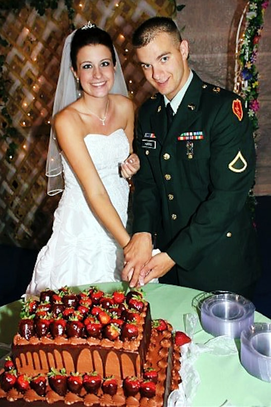 U.S. Army Pfc. Jason Harris shows off his dress uniform at his wedding in honor of Veterans Day on Foward Operating Base Frontenac in Afghanistan, Nov. 10, 2011. Harris is following in his father's footsteps as an Iraq and Afghanistan veteran assigned as a cavalry scout to the 25th Infantry Division's 5th Squadron, 1st Cavalry Regiment, 1st Stryker Brigade Combat Team.
