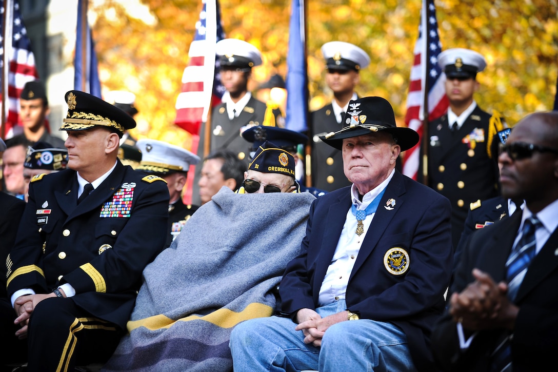 Ret. Army Col. Bruce P. Crandall, right, and Nicholas Oresko, center, both recipients of the Medal of Honor, attend Veterans Day activities at Madison Square Park in New York, Nov. 11, 2011. Oresko is the oldest living Medal of Honor recipient.