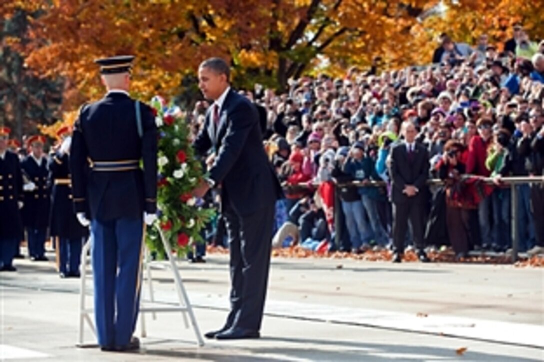 President Barack Obama places a wreath at the Tomb of the Unknowns at Arlington National Cemetery in Arlington, Va., Nov. 11, 2011.