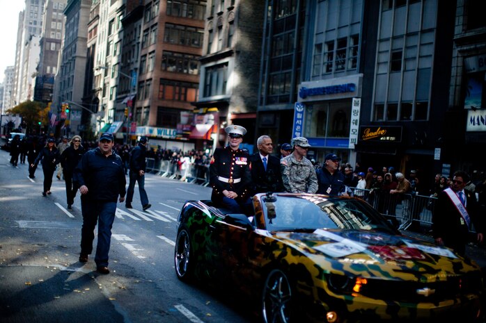 NEW YORK -- Marine veteran, Cpl. Aaron Mankin, participated in the 92st Anniversary of The New York City Veterans Day Parade, here, Nov. 11. Makin was  On May 11th, 2005, he was wounded when the 26-ton amphibious assault vehicle he was traveling in rolled over an improvised explosive device and was propelled 10 feet in the air. He has undergone more than 60 surgeries and acts as a spokemen for wounded service members. The parade is hosted by the United War Veterans Council, Inc. on behalf of the City of New York. It is the oldest and largest of its kind in the nation. Since November 11, 1919, the parade has provided an opportunity for Americans and International visitors to honor those who have served in the nation’s largest city. Sgt. Dakota Meyer, the recently awarded Marine Medal of Honor recipient, rode in the parade. Major Gen. Melvin Spiese, Deputy Commanding General, I Marine Expeditionary Force, represented the Marine Corps as one of the reviewing officials of the parade. (Marine Corps photo by Sgt. Randall A. Clinton / RELEASED)