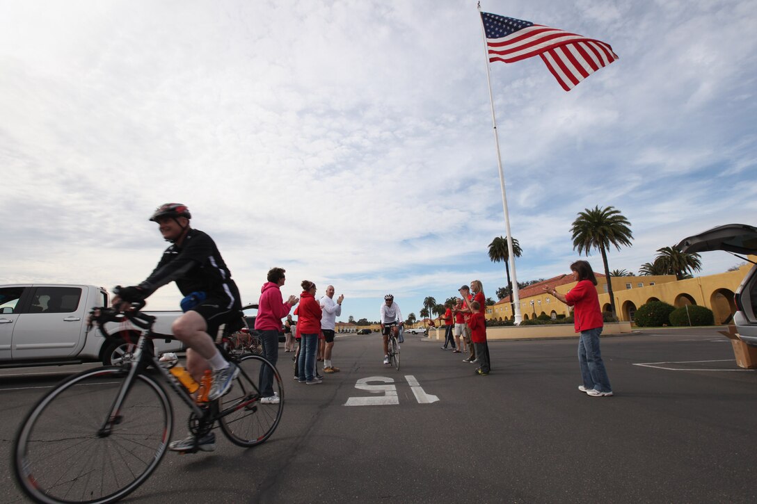 The final group of cyclists complete the 40-plus mile trek from Camp Pendleton, Calif., to Marine Corps Recruit Depot, San Diego during the 4th Annual Padre Pedal Power Ride. The ride honored all veterans and raised money for the Semper Fi Fund, a non-profit organization that provides financial assistance and quality of life solutions for injured or severely ill service members.