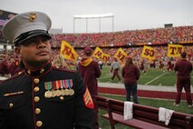 Sgt. Van Tulmau, an infantryman who enlisted in 2002, scans the crowd before the opening kickoff of the Golden Gophers and Wisconsin Badgers matchup Nov. 12. Tulmau served as co-captain for the game with Curran Delaney, a Marine veteran who deployed to Iraq as a sniper. For additional imagery from the event, visit www.facebook.com/rstwincities.