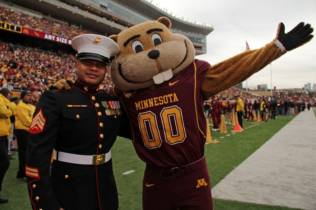 Sgt. Van Tulmau, a recruiter out of the Roseville, Minn., office, snatches up the University of Minnesota mascot, Goldy, for a photo op during the football game against University of Wisconsin. Nov. 12. Tulmau was named an honorary co-captain for the game in honor of Veteran’s Day. For additional imagery from the event, visit www.facebook.com/rstwincities.
