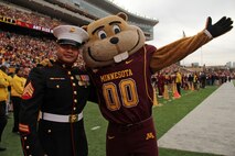 Sgt. Van Tulmau, a recruiter out of the Roseville, Minn., office, snatches up the University of Minnesota mascot, Goldy, for a photo op during the football game against University of Wisconsin. Nov. 12. Tulmau was named an honorary co-captain for the game in honor of Veteran’s Day. For additional imagery from the event, visit www.facebook.com/rstwincities.