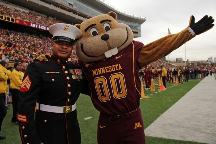 Sgt. Van Tulmau, a recruiter out of the Roseville, Minn., office, snatches up the University of Minnesota mascot, Goldy, for a photo op during the football game against University of Wisconsin. Nov. 12. Tulmau was named an honorary co-captain for the game in honor of Veteran’s Day. For additional imagery from the event, visit www.facebook.com/rstwincities.