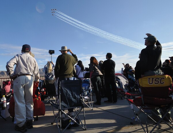 Spectators watch the sky as the United States Air Force Air Demonstration Squadron Thunderbirds, fly overhead during the 2011 Aviation Nation Open House Nov. 12, at Nellis Air Force Base, Nev. Aviation Nation celebrates 70 years of airpower in Las Vegas and the Air Force's accomplishments in air, space and cyberspace. (U.S. Air Force photo by Tech. Sgt. Bob Sommer/Released)