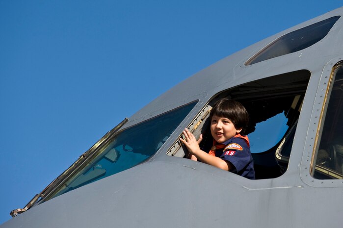 An attendee looks out of a C-17 Globemaster III during the 2011 Aviation Nation Open House Nov. 12, at Nellis Air Force Base, Nev. Aviation Nation celebrates 70 years of airpower in Las Vegas and the Air Force's accomplishments in air, space and cyberspace. (U.S. Air Force photo by Senior Airman Brett Clashman/Released)