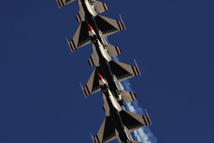The United States Air Force Air Demonstration Squadron Thunderbirds, move from trail position into diamond formation over Nellis during the 2011 Aviation Nation Nellis Open House Nov. 12, at Nellis Air Force Base, Nev. Aviation Nation celebrates 70 years of airpower in Las Vegas and the Air Force's accomplishments in air, space and cyberspace. (U.S. Air Force photo by Senior Master Sgt.  Kevin Gruenwald/Released)





