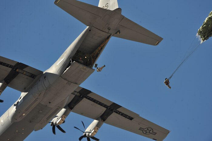 U.S. Air Force Airmen, 820th RED HORSE airborne flight, jump from a C-130 Hercules during the 2011 Aviation Nation Open House Nov. 12, at Nellis Air Force Base, Nev. Aviation Nation celebrates 70 years of airpower in Las Vegas and the Air Force's accomplishments in air, space and cyberspace. (U.S. Air Force photo by Senior Master Sgt.  Kevin Gruenwald/Released)





