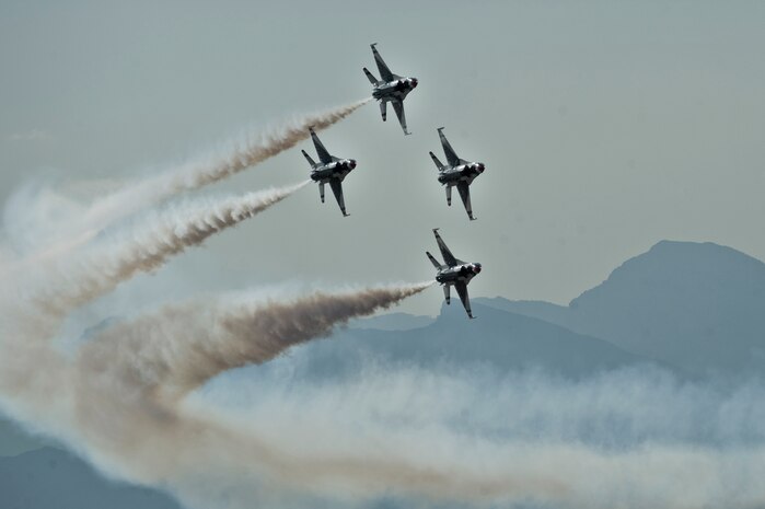 The United States Air Force Air Demonstration Squadron Thunderbirds, perform a diamond pass during the 2011 Aviation Nation Open House Nov. 12, at Nellis Air Force Base, Nev. Aviation Nation celebrates 70 years of airpower in Las Vegas and the Air Force's accomplishments in air, space and cyberspace. (U.S. Air Force photo by Airman 1st Class Daniel Hughes/Released)