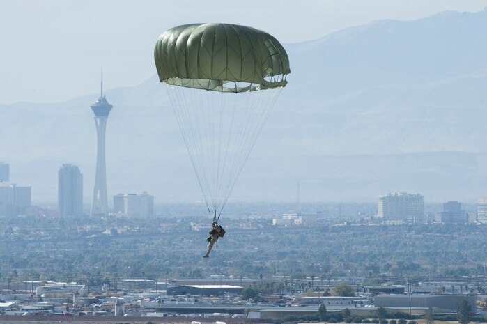 A U.S. Air Force Airman, 820th RED HORSE airborne flight, parachutes into a drop zone from a C-130 Hercules during the 2011 Aviation Nation Open House Nov. 12, at Nellis Air Force Base, Nev. Aviation Nation celebrates 70 years of airpower in Las Vegas and the Air Force's accomplishments in air, space and cyberspace. (U.S. Air Force photo by Airman 1st Class Daniel Hughes/Released)
