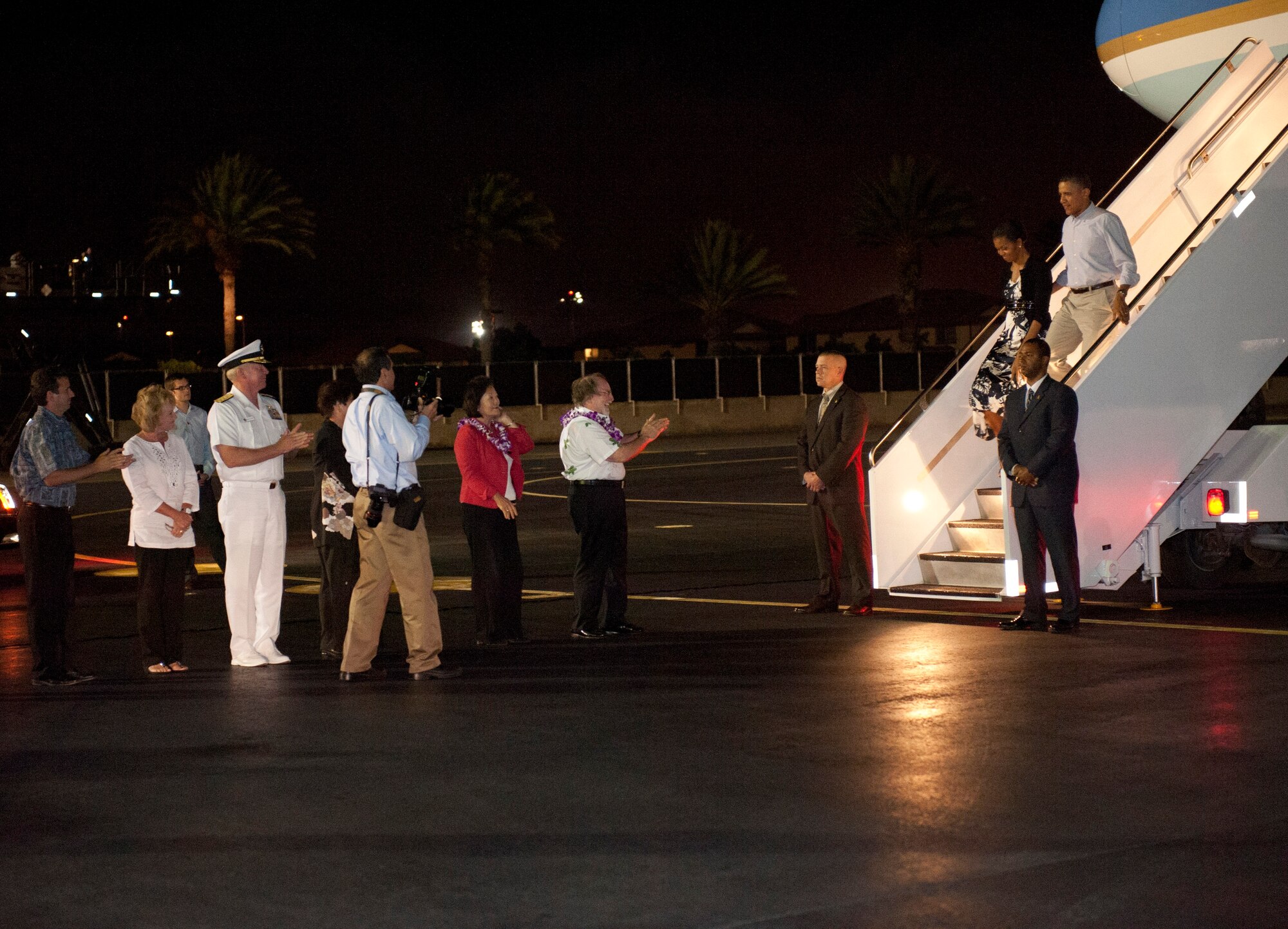 JOINT BASE PEARL HARBOR-HICKAM, Hawaii--Hawaii Governor Neil Abercrombie and Adm. Robert F. Willard, commander, U.S. Pacific Command, greet President Barack Obama and First Lady Michell Obama during their arrival at Joint Base Pearl Harbor-Hickam, Hawaii, for the Asia-Pacific Economic Cooperation summit, Nov. 10. APEC is the premier economic forum in the Asia-Pacific region.  Established in 1989 and comprising 21 member economies from around the Pacific Rim, including the U.S., APEC fosters growth and prosperity by facilitating economic cooperation and expanding trade and investment throughout the region. (U.S. Air Force photo/Senior Airman Lauren Main)  