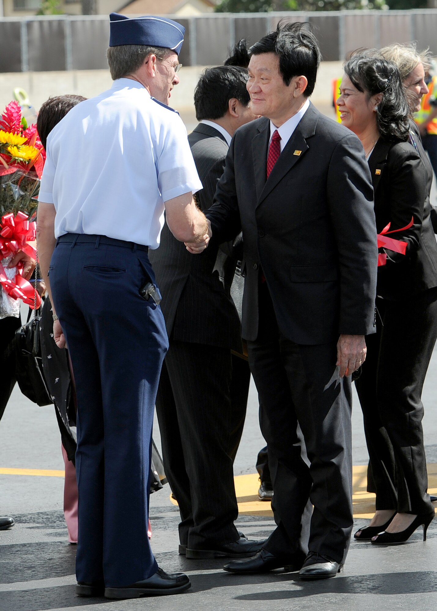 JOINT BASE PEARL HARBOR-HICKAM, Hawaii--Maj. Gen. Jon R. Shasteen, mobilization assistant to the Commander, Pacific Air Forces, greets Vietnam President, Truong Tan Sang during his arrival at Joint Base Pearl Harbor-Hickam, Hawaii, for the Asia-Pacific Economic Cooperation summit, Nov. 10. APEC is the premier economic forum in the Asia-Pacific region.  Established in 1989 and comprising 21 member economies from around the Pacific Rim, including the U.S., APEC fosters growth and prosperity by facilitating economic cooperation and expanding trade and investment throughout the region. (U.S. Air Force photo/Tech. Sgt. Jerome S. Tayborn/released)  